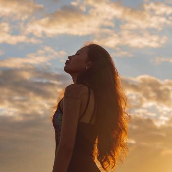image of a girl in front of sunset
