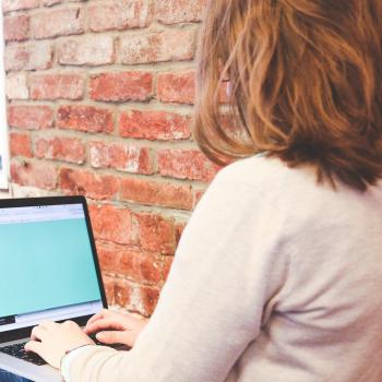 woman typing on a keyboard